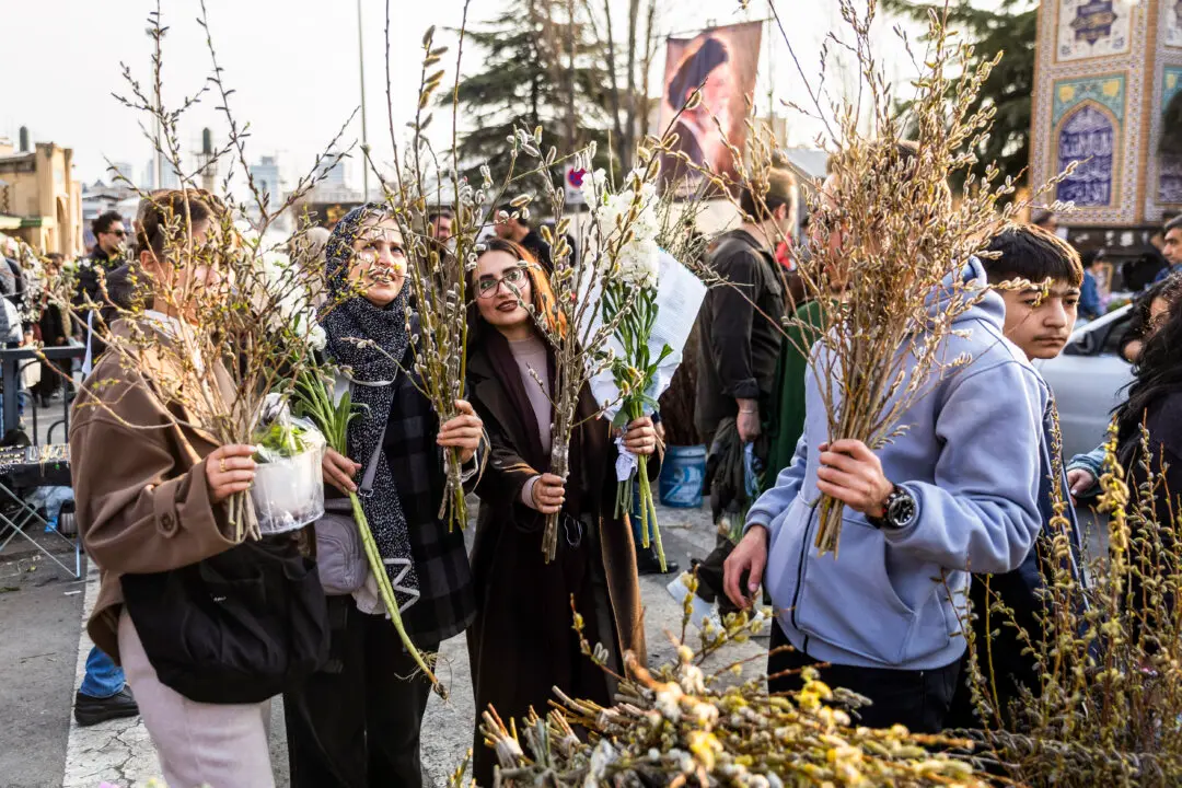 TEHRAN, IRAN - MARCH 19: People shop for flowers at a market ahead of Nowruz celebrations on March 19, 2026 in Tehran, Iran. Nowruz, or Persian New Year, is a festival celebrated worldwide by various ethnicities. It takes place on the spring equinox, according to the Iranian Solar Hijri calendar. This year the holiday falls three weeks into the war that broke out on February 28 with US-Israeli joint attacks on Iran, which killed Supreme Leader Ayatollah Ali Khamenei. Iran has retaliated by firing waves of missiles and drones at Israel, and targeting U.S. allies in the region. (Photo by Majid Saeedi/Getty Images)