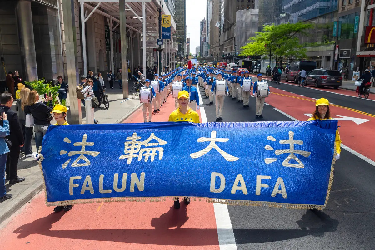 Day in Photos: Falun Dafa Day, Mayor Acting as Agent for China, and National Police Week