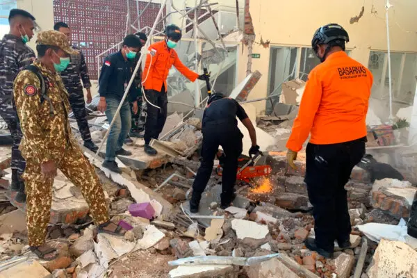 Search Operations Continue After Powerful Indonesian Earthquake