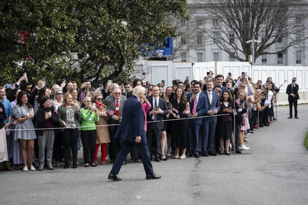 President Donald Trump greets supporters as he departs the White House on March 11, 2026. (Madalina Kilroy/The Epoch Times)