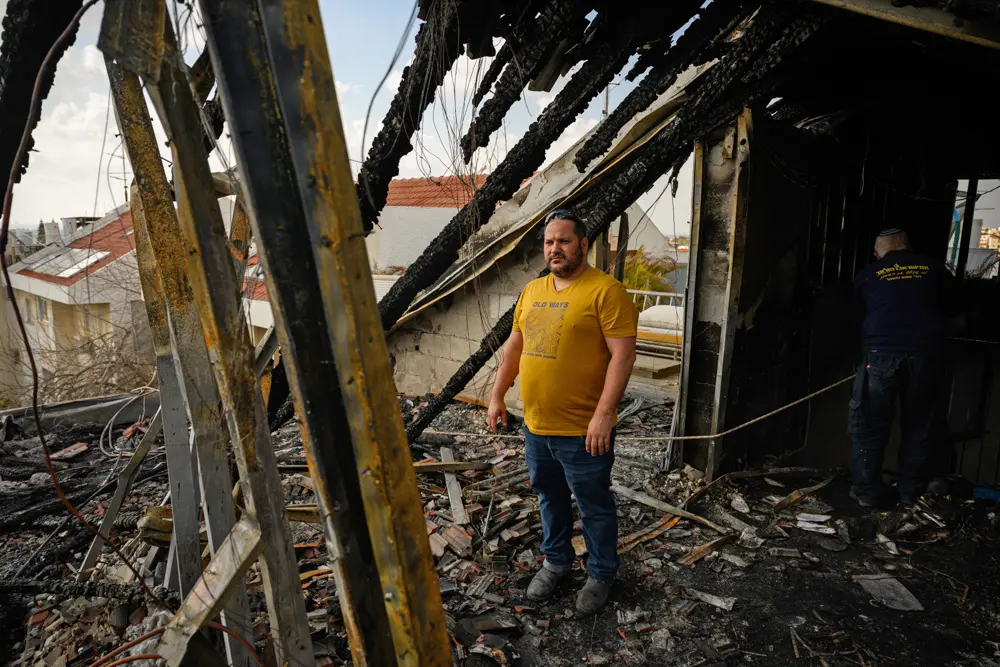 Homeowner Ram Rahamim Masassa, surveys the damage to his home caused by a missile impact three days earlier n Shoham, Israel. on March 16, 2026. (Alexi J. Rosenfeld/Getty Images)